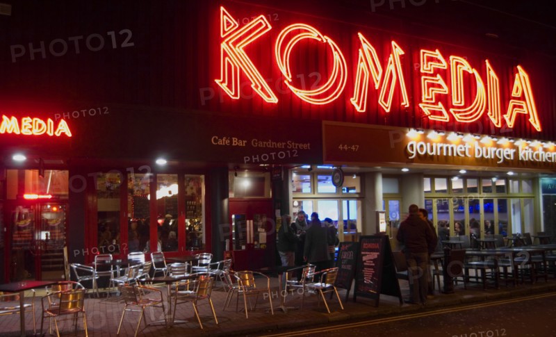 ENGLAND, East Sussex, Brighton, "Exterior of the Komedia theatre, cafe and bar in Gardner Street. Neon Sign"