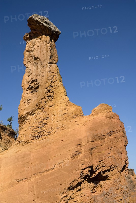 FRANCE, Provence Cote d’Azur, Vaucluse, "Colorado Provencal.  Cheminee de Fee or Fairy Chimneys.  Tall, eroded ochre rock pinnacle."