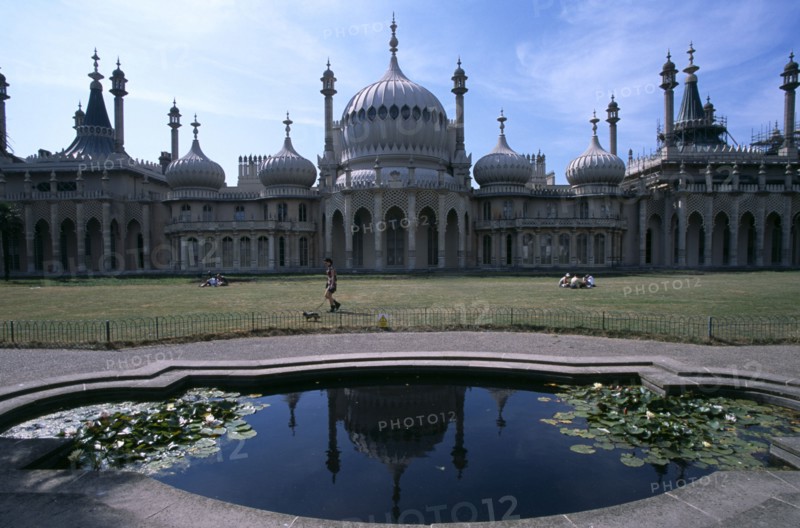 ENGLAND, East Sussex, Brighton, The Royal Pavilion exterior seen from across lilly pond.