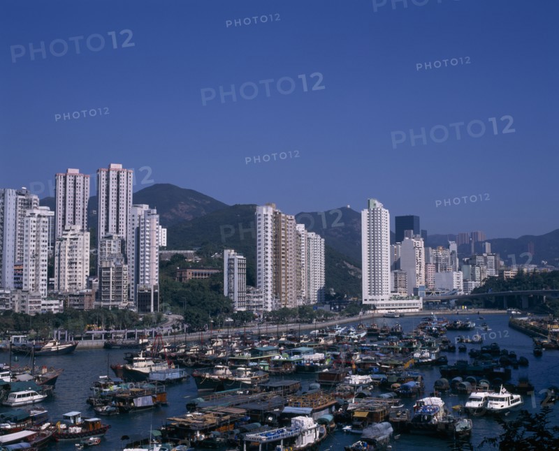 CHINA, Hong Kong, Aberdeen, "Aberdeen harbour and typhoon shelter.  Junks, houseboats, fishing boats and other vessels with high rise city buildings beyond."