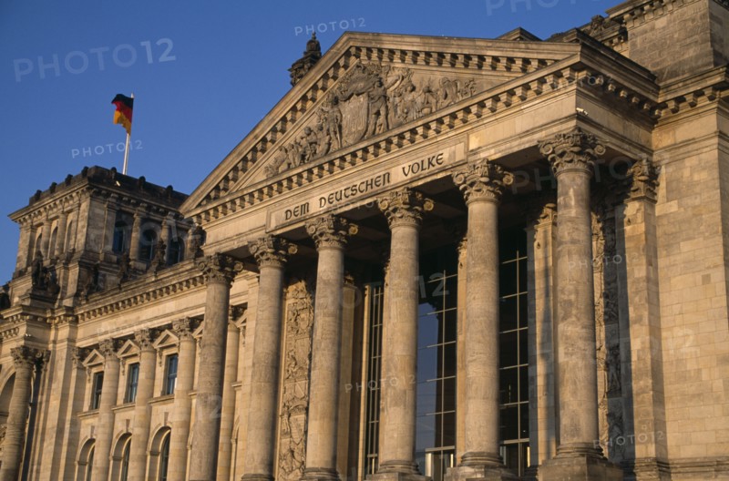 GERMANY, Berlin, The Reichstag  seat of the German Parliament.  Part view of exterior designed by Paul Wallot 1884-1894.  To The German People inscribed above entrance in German.