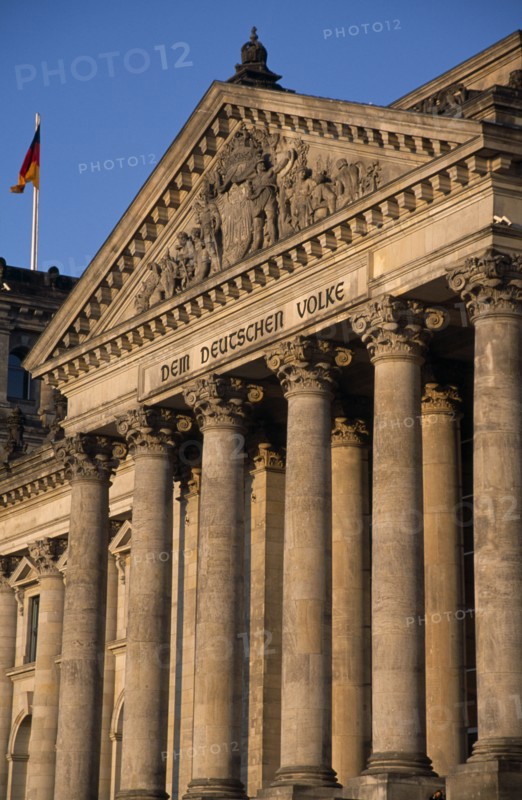 GERMANY, Berlin, The Reichstag  seat of German Parliament.  Part view of colonnaded exterior designed by Paul Wallot 1884-1894.  To The German People inscribed above entrance .
