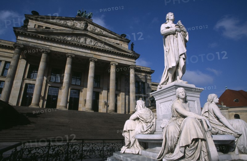 GERMANY, Berlin, The Friedrich Schiller Memorial statue by Reinhold Begas in front of the former Schauspielhaus  now Konzerthaus home of the Berlin Symphony Orchestra.