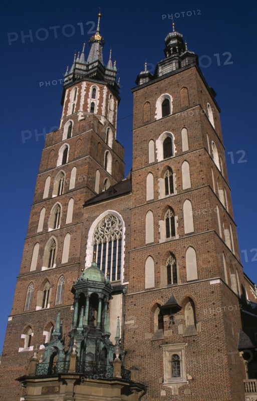 POLAND, Krakow, Mariacki Basilica or Church of St Mary.  Gothic  red brick exterior built in the fourteenth century.