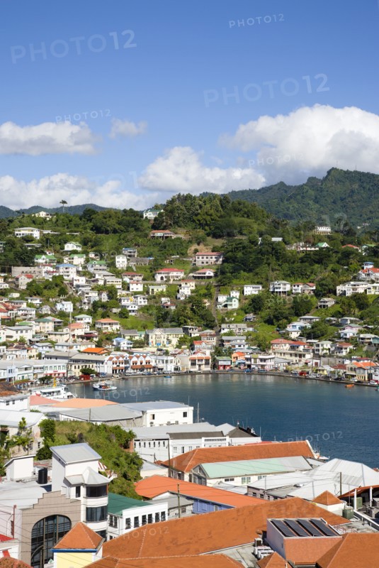 WEST INDIES, Grenada, St George, The Carenage harbour of the capital city of St George's surrounded by hills lined with houses and other buildings