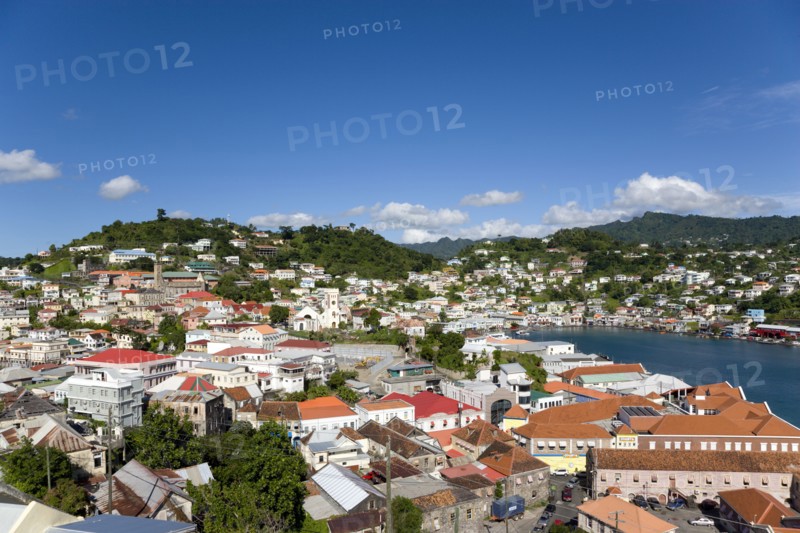WEST INDIES, Grenada, St George, The Carenage harbour of the capital city of St George's surrounded by hills lined with houses and other buildings