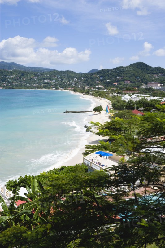 WEST INDIES, Grenada, St George, Waves of the aquamarine sea breaking on the two mile stretch of the white sand Grand Anse Beach