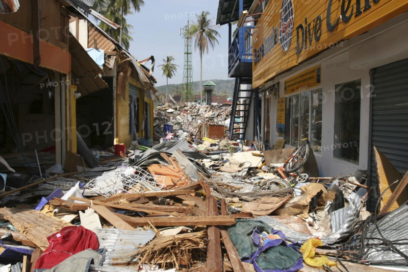 THAILAND, Phang Nga District, Takua Pa, "Tsunami. Phi Phi on the 11th day after the tsunami hit, Shattered shops and restaurants with 2 feet of debris covering what was once the walkway. On the 6th Jan."