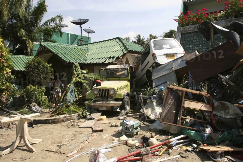 THAILAND, Phang Nga District, Phuket, "Tsunami carnage the day after. Two cars are left in the grounds of the Laonte Hotel. Patong is the busiest part of Phuket with hotels, bars, and shops in a very tightly condensed area, and being peak season had thousands of tourists in the area. On the 27th Dec."