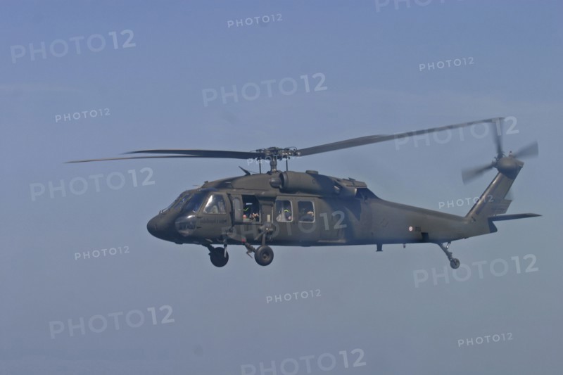 THAILAND, Phuket, "Tsunami. A helicopter in flight with rescue workers are flown from Phuket to look for missing victims in Phangng, north of Phuket. On the 31st Dec."