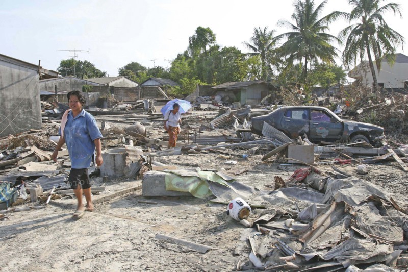 THAILAND, Phang Nga District, Nam Khem, "Tsunami. Thais walk through what is left of there vilage, nothing is left standing in the village of Nam Kem, about 125kms north of Phuket.In Phangnga district. On the 31st Dec."