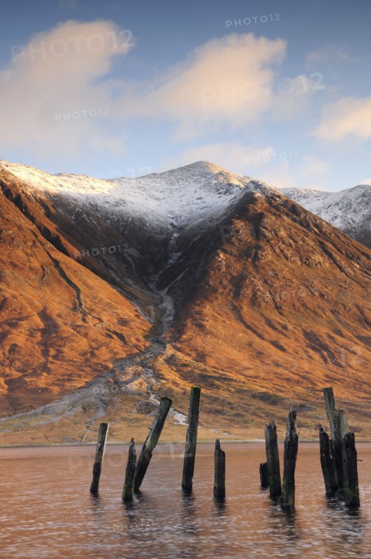 Scotland, Argyll, Loch Etive, Disused jetty with snowy mountains (Ben Starav)