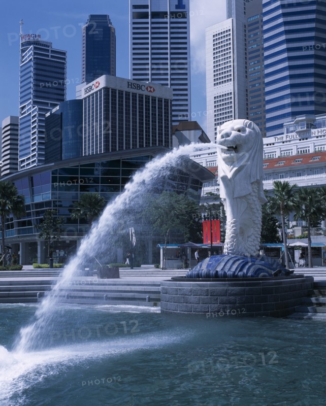 SINGAPORE, Merlion Park, "Merlion statue in Merlion Park with HSBC bank , The Fullerton Hotel and other city skyscrapers behind"
