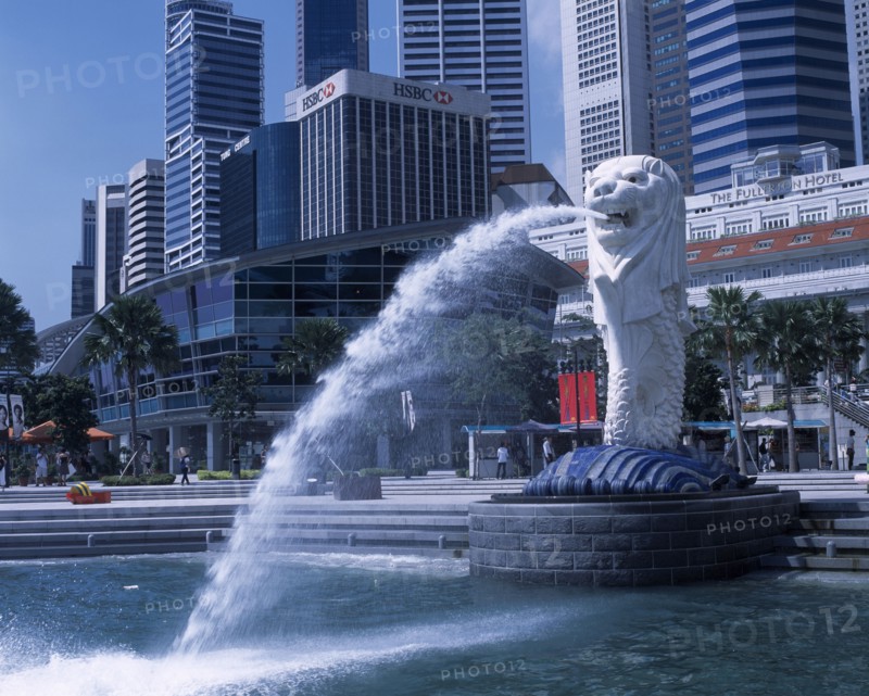 SINGAPORE, Merlion Park, "Merlion statue in Merlion Park with HSBC bank , The Fullerton Hotel and other city skyscrapers behind"