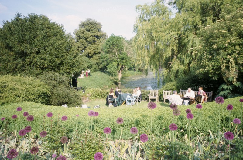 ENGLAND, East Sussex, Glyndebourne, Opera attendees enjoying picnics in the gardens during interval.