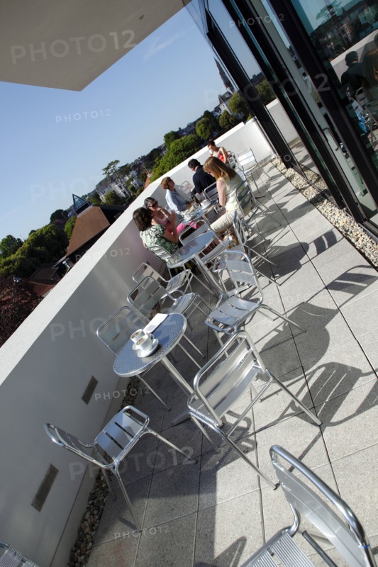 ENGLAND, East Sussex, Eastbourne, Towner Gallery building balcony outside the cafe area with visitors drinking coffee.