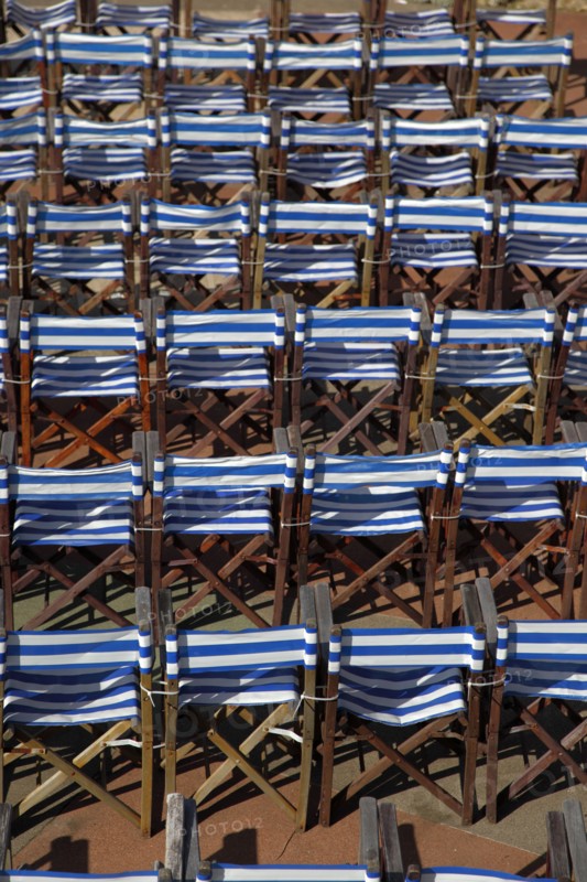 ENGLAND, East Sussex, Eastbourne, Details of blue and white deck chairs at the band stand.