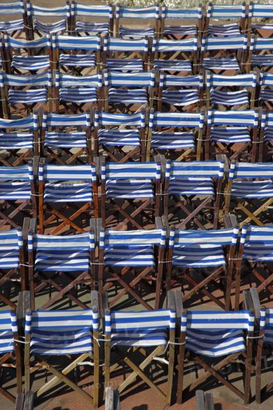 ENGLAND, East Sussex, Eastbourne, Details of blue and white deck chairs at the band stand.
