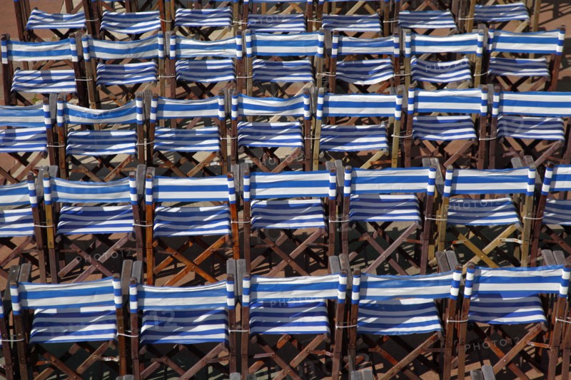 ENGLAND, East Sussex, Eastbourne, Details of blue and white deck chairs at the band stand.