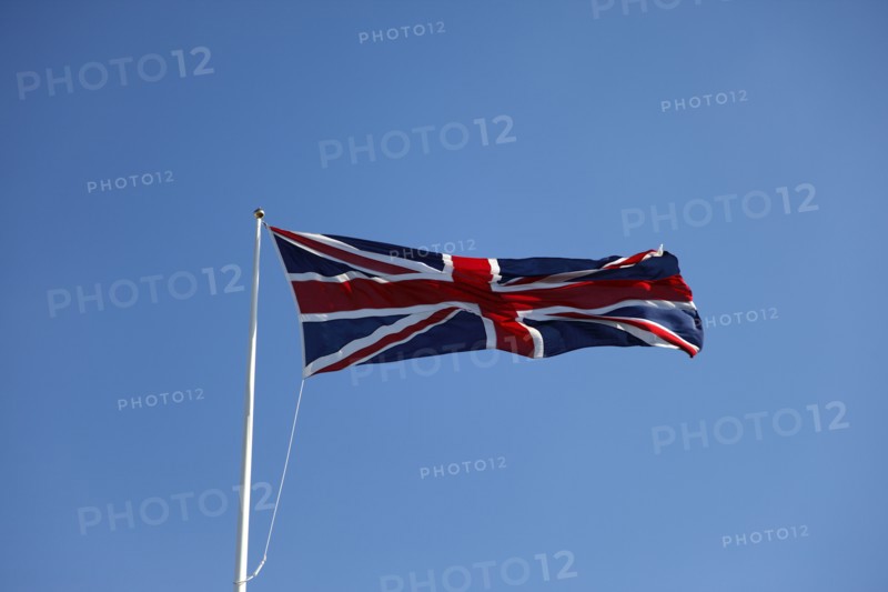 CLIMATE, Wind, Flags, British Union Jack flag flying in wind against blue sky.