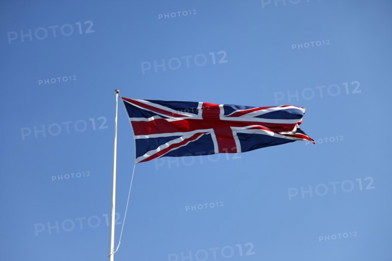 CLIMATE, Wind, Flags, British Union Jack flag flying in wind against blue sky.