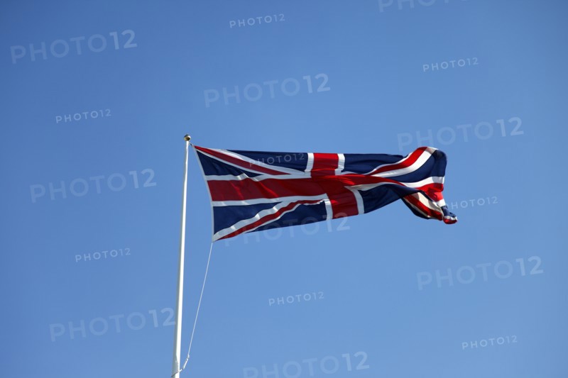 CLIMATE, Wind, Flags, British Union Jack flag flying in wind against blue sky.