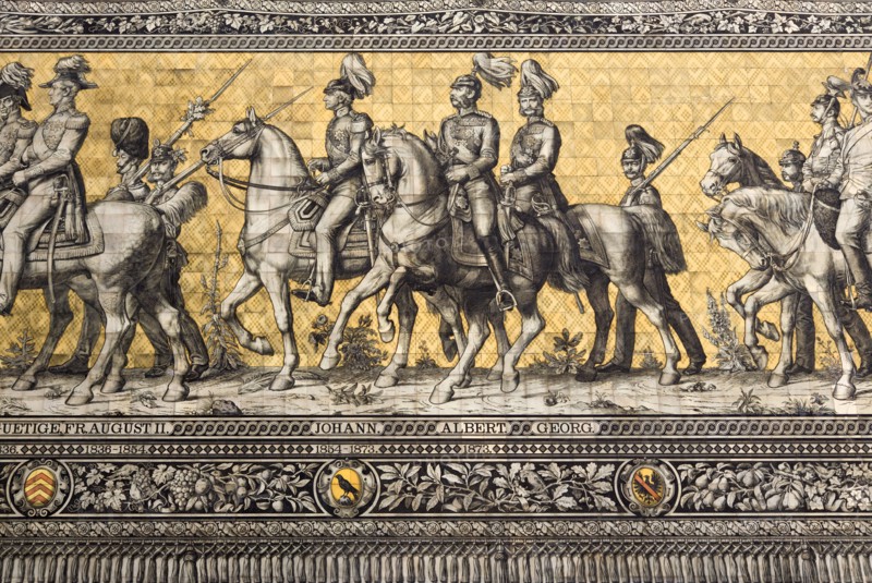 GERMANY, Saxony, Dresden, "Frstenzug or Procession of the Dukes in Auguststrasse a mural on 25,000 Meissen tiles that depicts 35 noblemen from the 12th century Konrad the Great, to Friedrich August III, Saxony's last king, who ruled from 1904-1918. It was originally painted by Wilhelm Walter between 1870 and 1876 but eventually, the stucco began to crumble and around 1906-'07 it was replaced by the tiles."