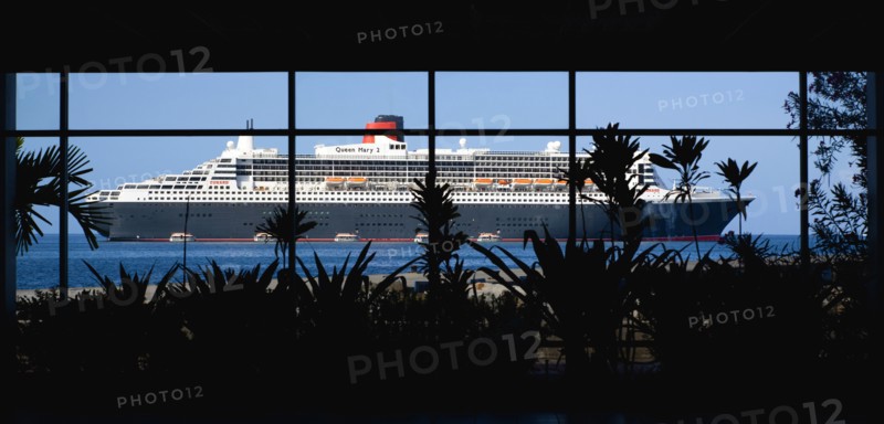 WEST INDIES, Grenada, St Georges, The Queen Mary 2 ship seen through the glass windows of the Cruise Ship Terminal.