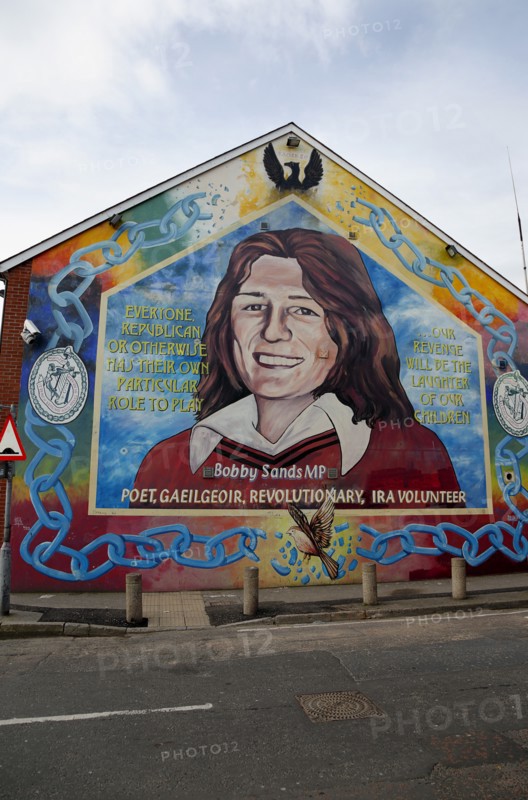 IRELAND, North, Belfast, "Falls Road, Mural of Bobby Sands on the gable end of the Sinn Fein headquarters on the corner of Sevastapol Street."