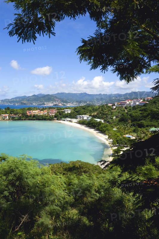 WEST INDIES, Grenada, St George, BBC Beach in Morne Rouge Bay lined with holiday apartments with the capital of St Georges in the distance.