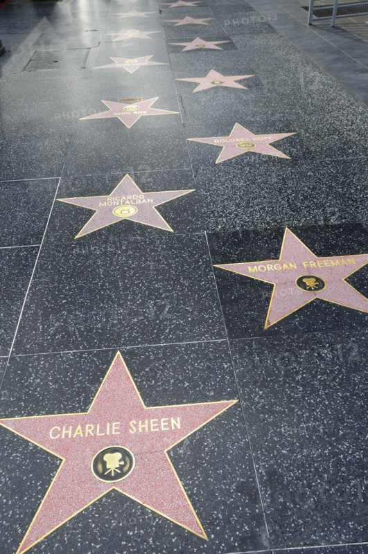 USA, California, Los Angeles, "Hollywood Walk of Fame along Hollywood Boulevard showing stars of Charlie Sheen, Morgan Freeman & Ricardo Montalban."
