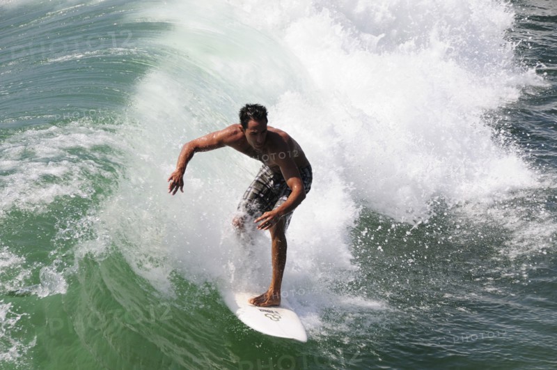 USA, California, Los Angeles, "Surfer riding wave, Venice Beach"