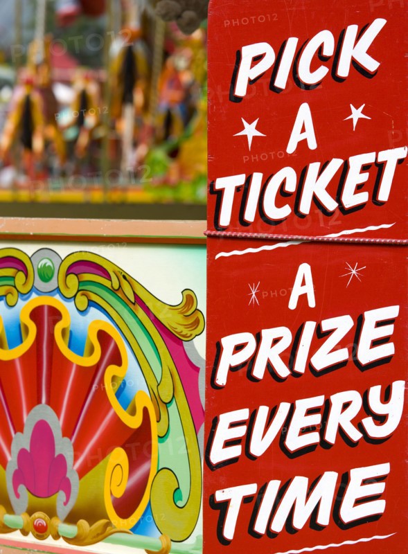 ENGLAND, West Sussex, Findon, Findon village Sheep Fair Colourful sign on a fairground stall that reads Pick A Ticket A Prize Every Time.