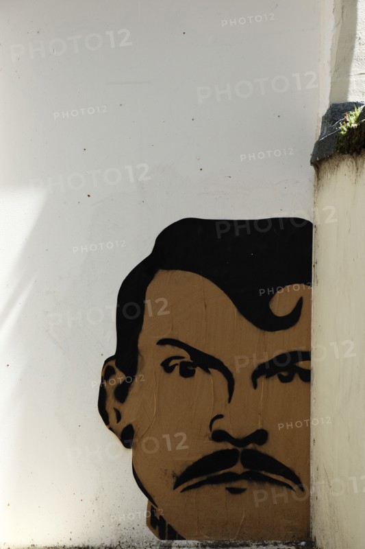 ENGLAND, East Sussex, Brighton, "Little East Street, Mural of mans Head sprayed on wall."