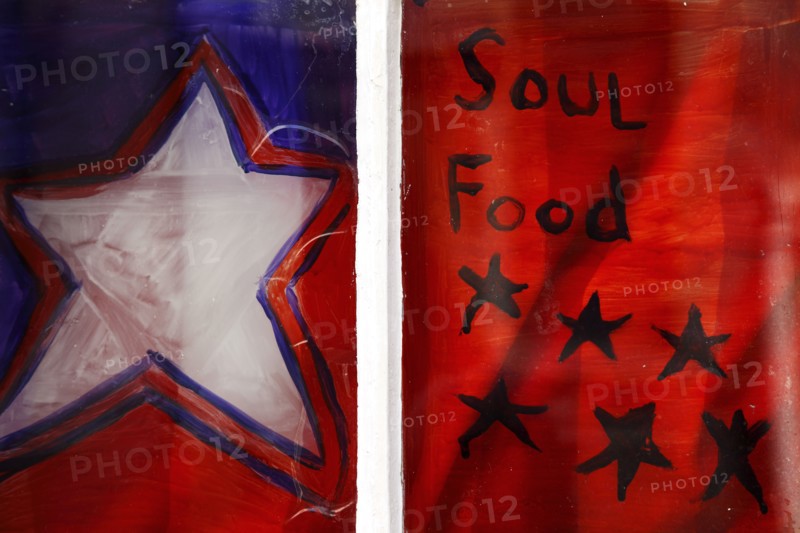 ENGLAND, East Sussex, Brighton, Window Decorated with Painted Stars on Restaurant.