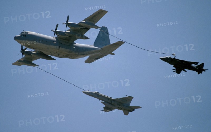 TRANSPORT, Air, Jet Fighter, Two Jets being refueled in mid air by C-130 Hecules.