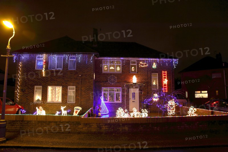 ENGLAND, West Sussex, Southwick, Cul de Sac of houses decorated with fairy lights for Christmas.