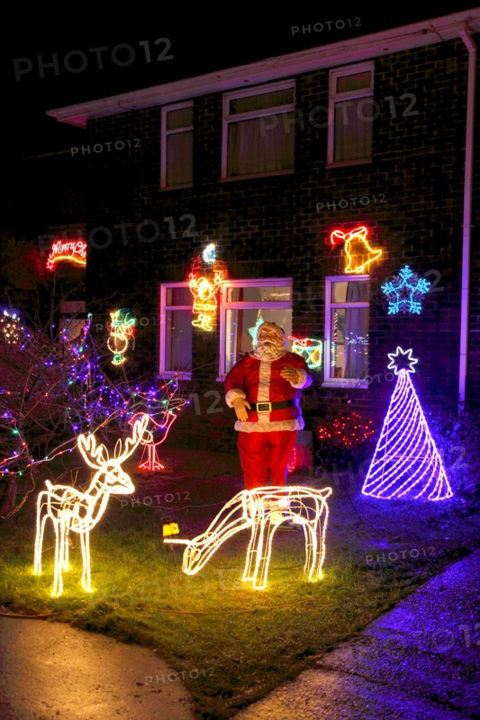 ENGLAND, West Sussex, Southwick, Cul de Sac of houses decorated with fairy lights for Christmas.