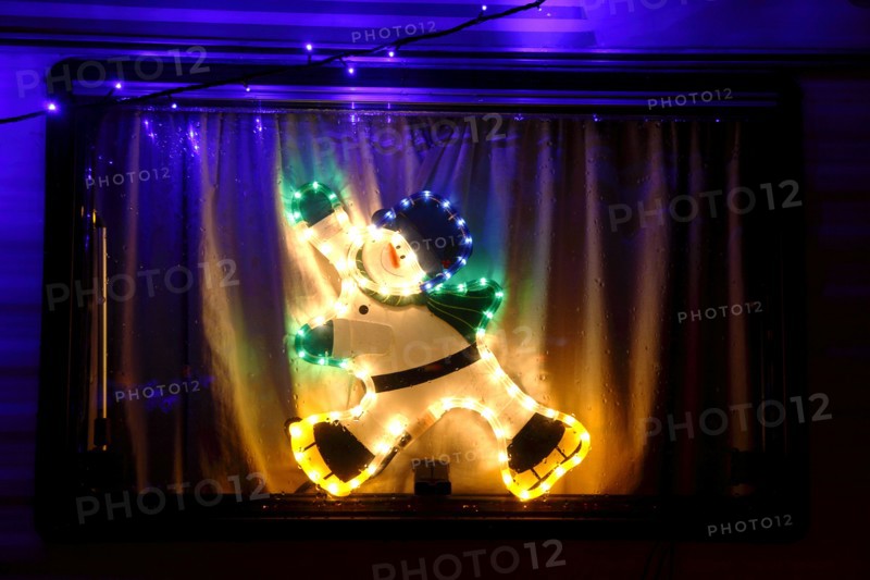 ENGLAND, West Sussex, Southwick, Caravan decorated with fairy lights for Christmas.