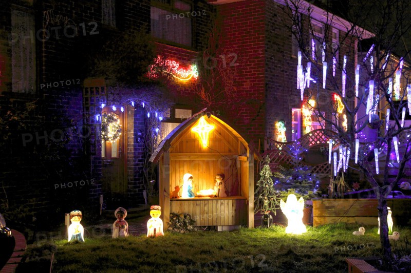 ENGLAND, West Sussex, Southwick, Cul de Sac of houses decorated with fairy lights for Christmas.