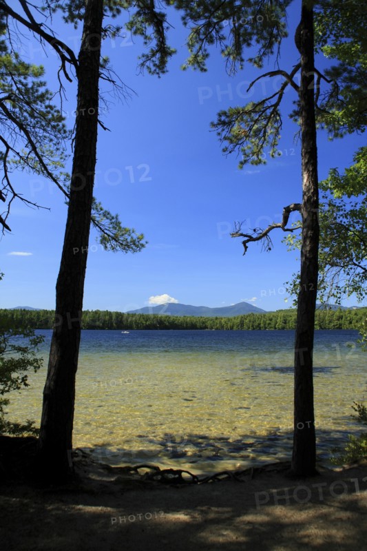 USA, New Hampshire, Tamworth, White Lake Campground with clear shallow water in the foreground.