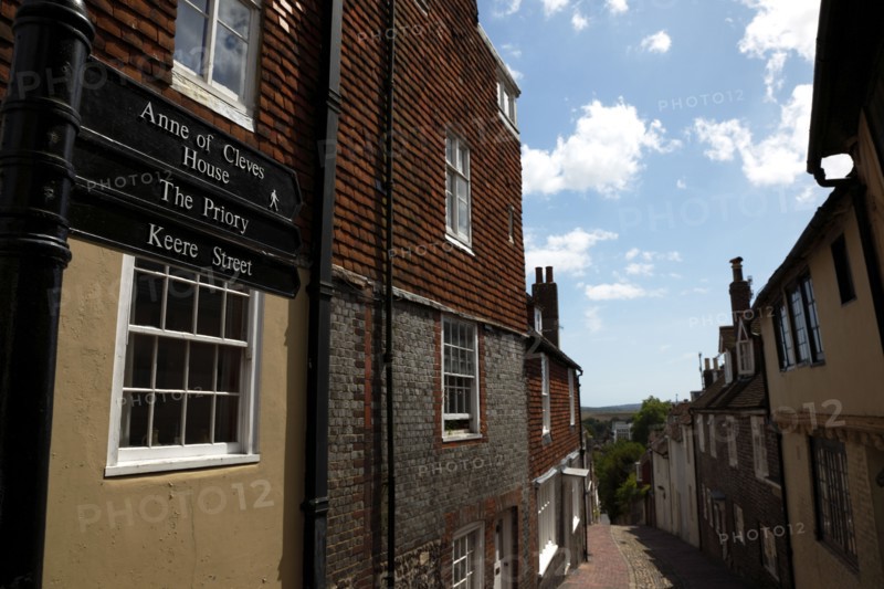 ENGLAND, East Sussex, Lewes, "High Street, Keere Street cobbled pathway with traditional buildings."