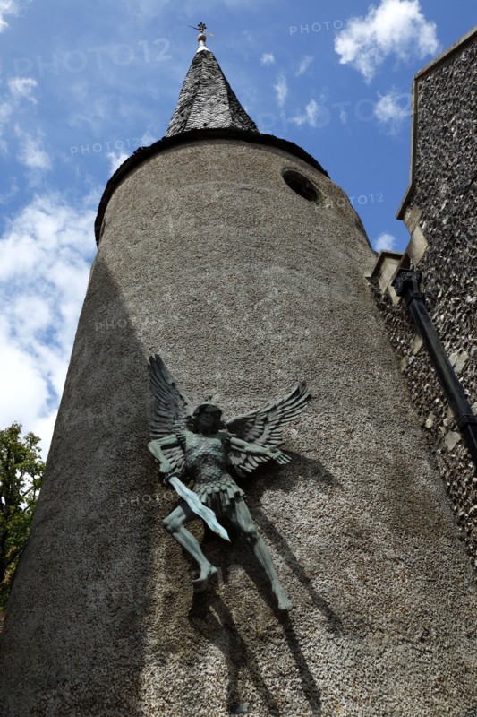 ENGLAND, East Sussex, Lewes, "High Street, St Michael's Church detail with sculpture of the Arcangel."