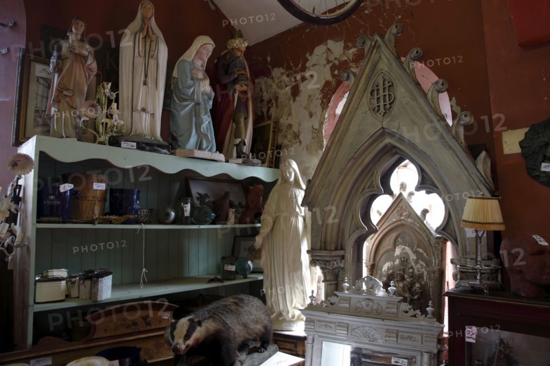 ENGLAND, East Sussex, Lewes, "North Street, Flea Market antigues and second hand goods shop. Christian statues of Mary on sale."