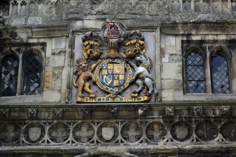 ENGLAND, Wiltshire, Salisbury, "Detail of weather worn North Gate in the High Street. Royal Coat of Arms with Diev et mon Droit written in latin, meaning God and my Right."