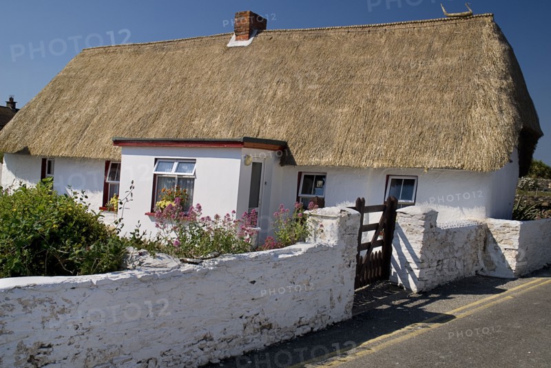 IRELAND, County Weford, Kilmore Quay, Thatched cottage in fishing village renowned for such dwellings.