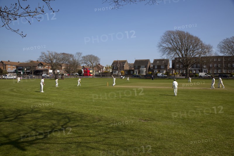 England, West Sussex, Southwick, Local Cricket team playing on village green.