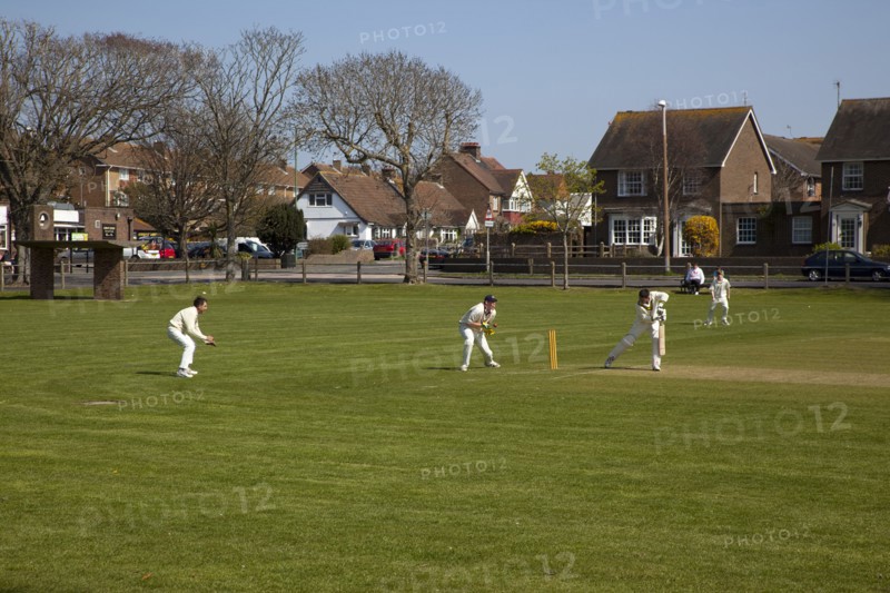 England, West Sussex, Southwick, Local Cricket team playing on village green.