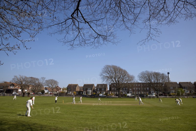 England, West Sussex, Southwick, Local Cricket team playing on village green.