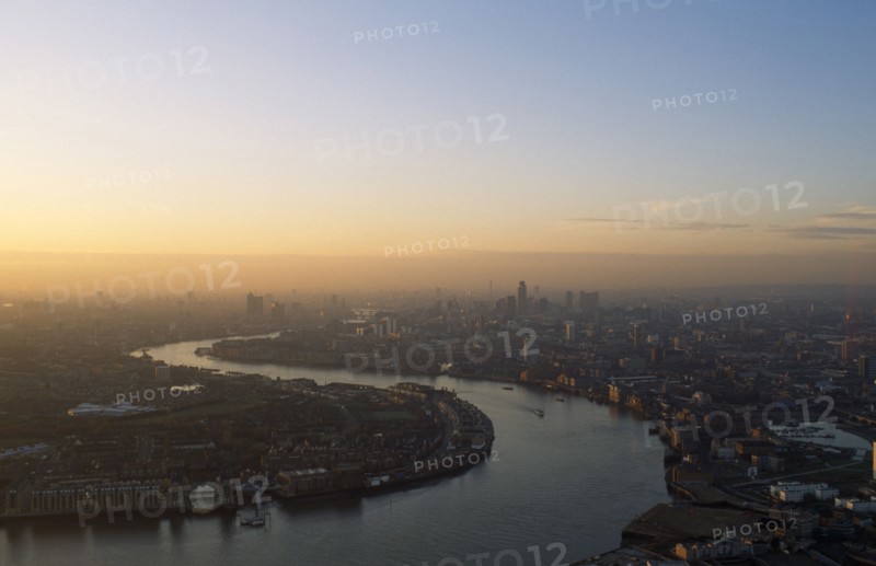 England, London, Canary Wharf, View over the City of London from Canada Tower in a  haze of smog at dawn.